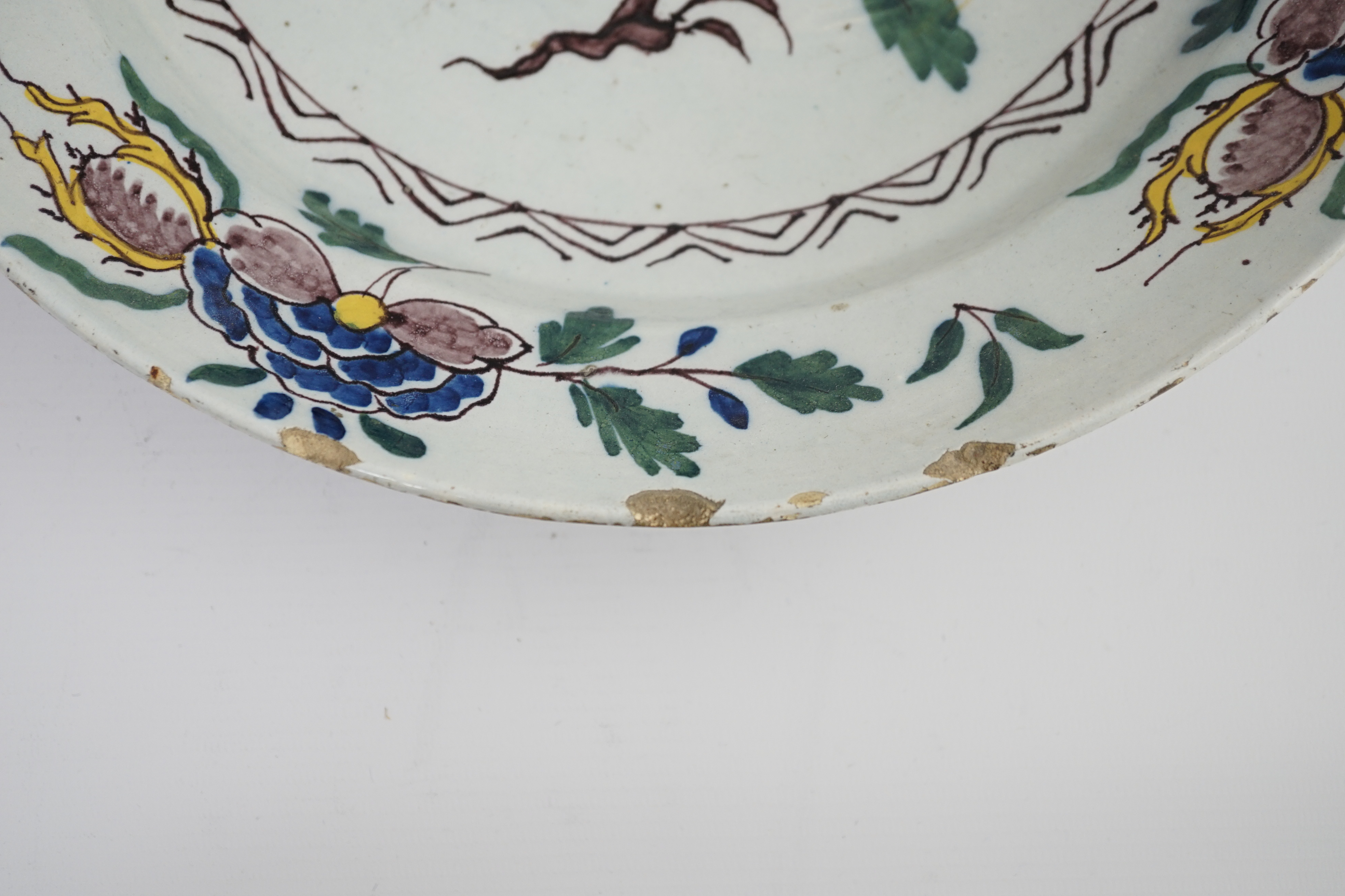 A mid 18th century English polychrome delftware dish